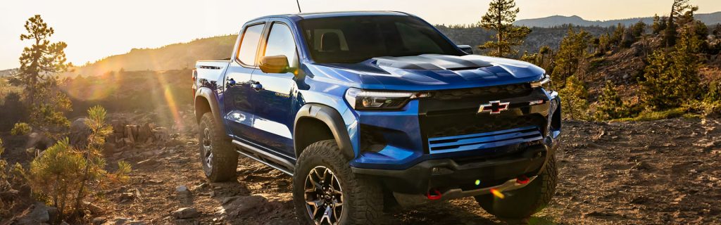 Blue Chevy truck at sunset.